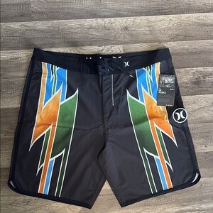 Hurley Black and Orange Board Shorts with Geometric Design